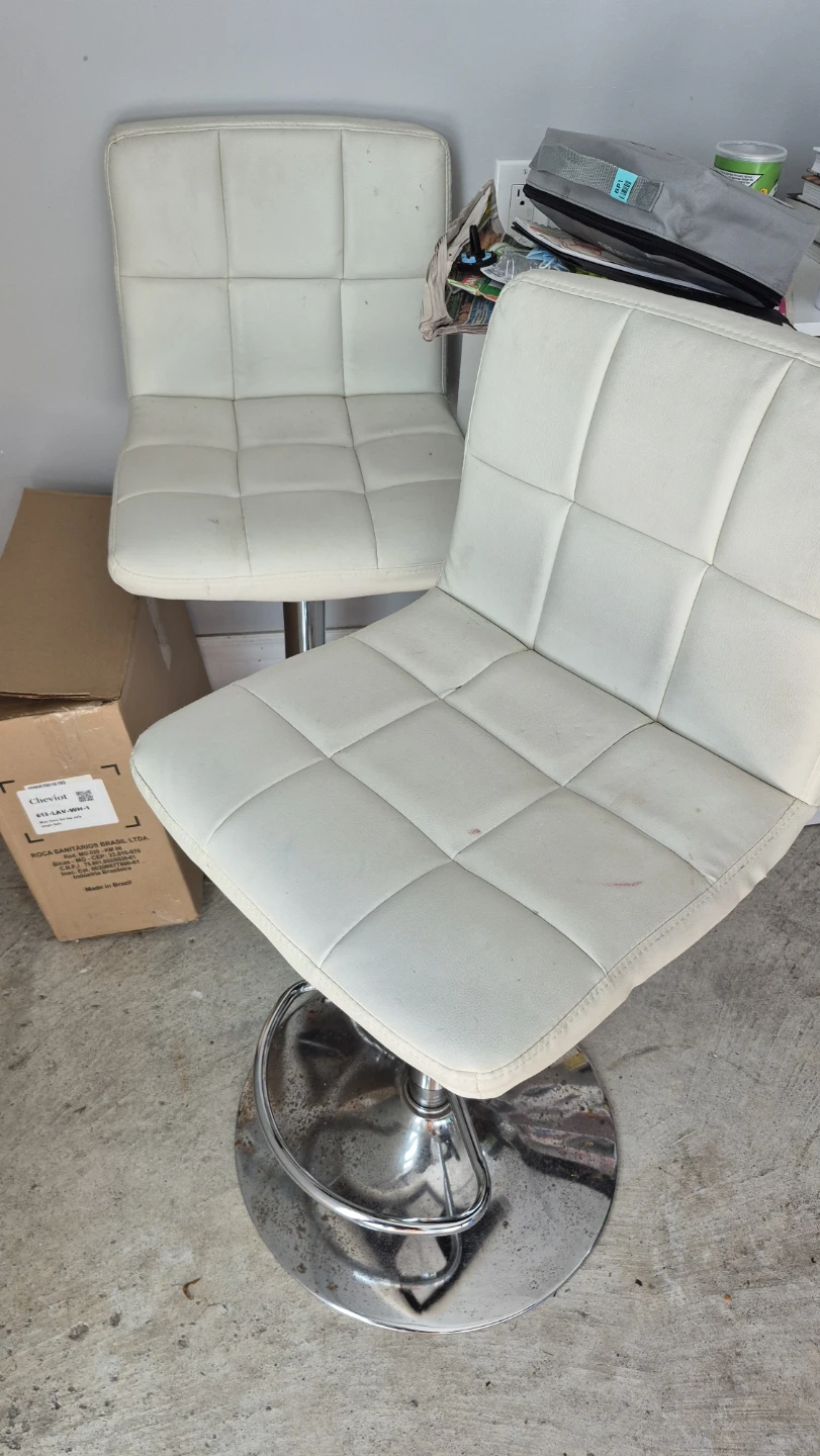 Two white tall chairs