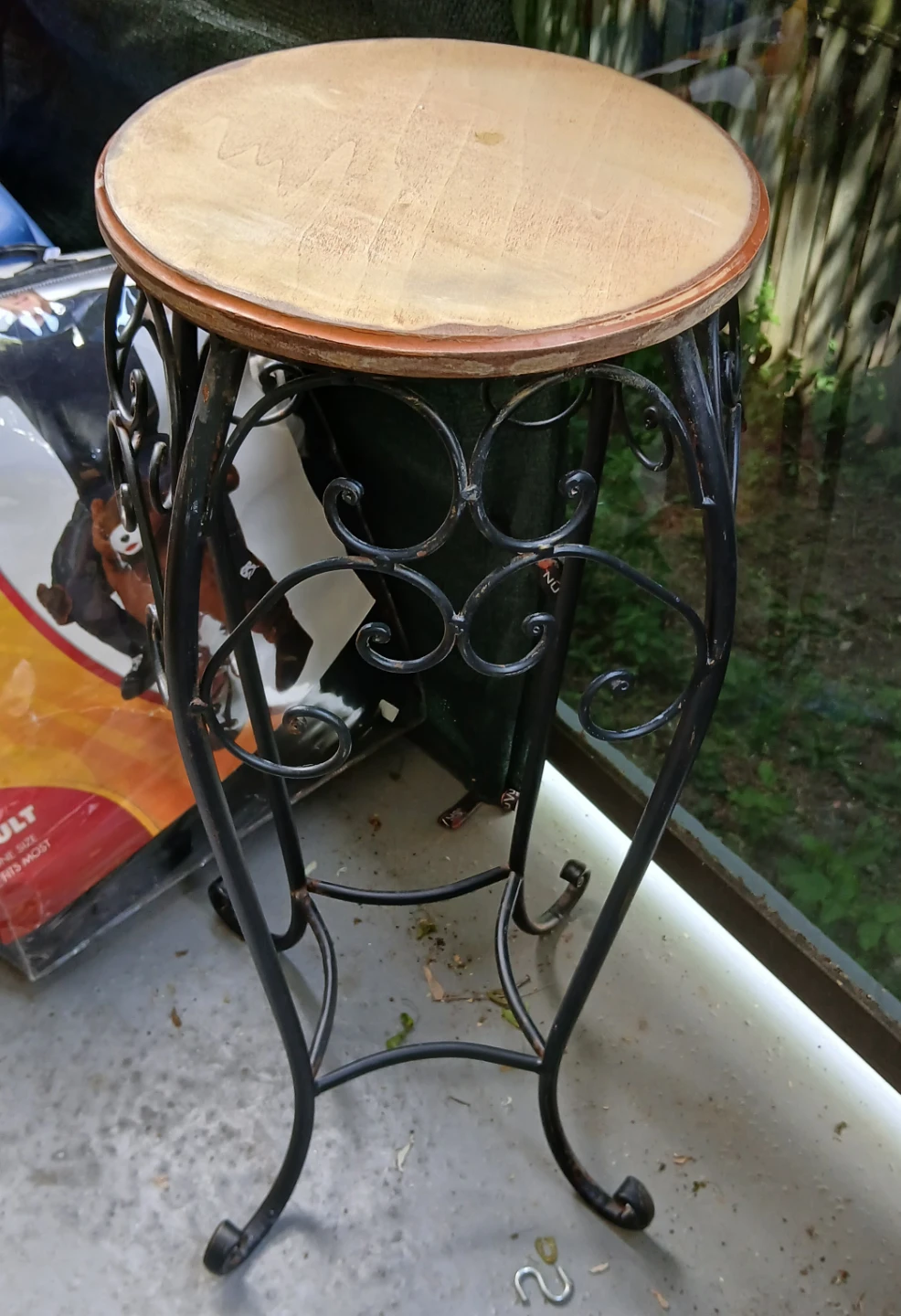 Ornate Black Metal Plant Stand with Wooden Top