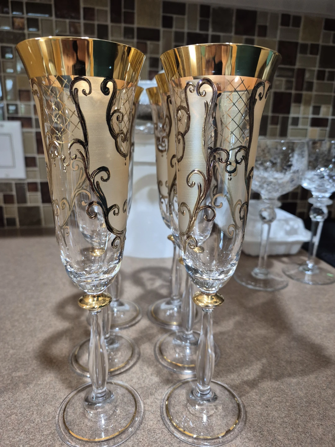 Set of 6 champagne flutes with gold trim and ornate design