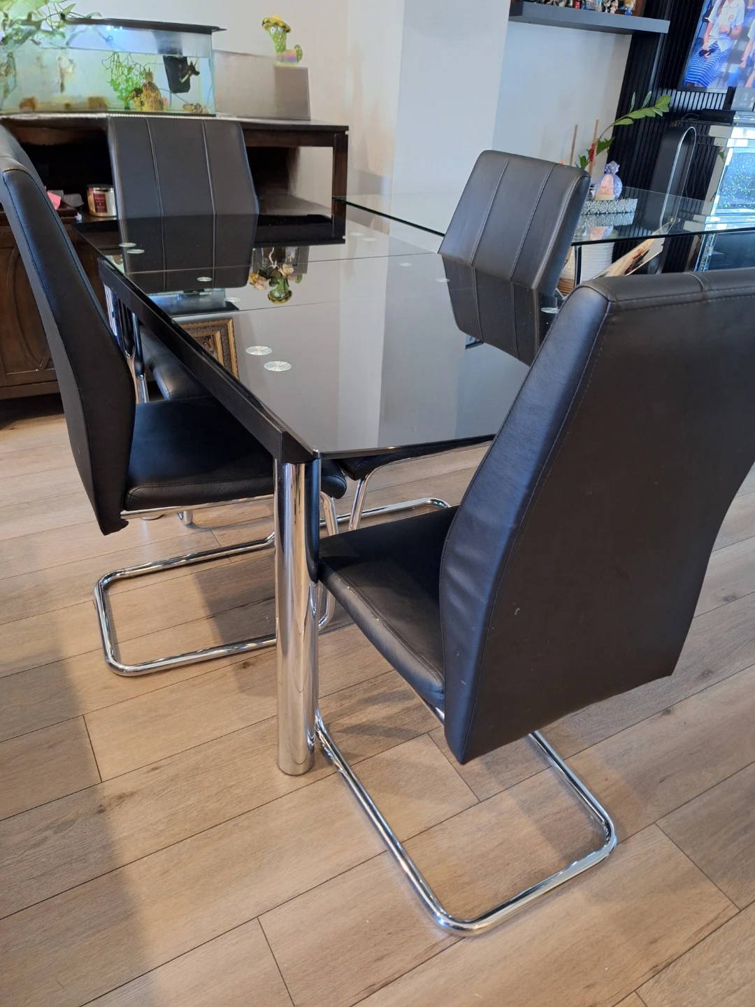 Glass dinning table and 4 chairs for sale