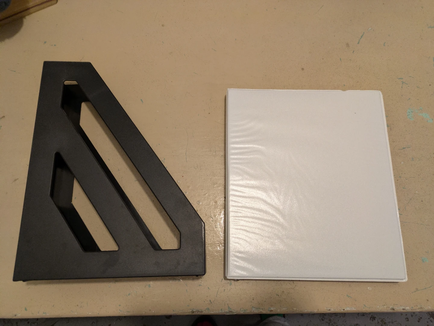 Black Magazine Holder and White Binder