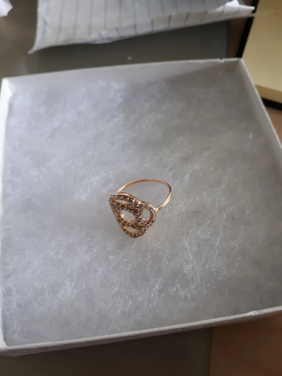 Gold tone ring with clear stones