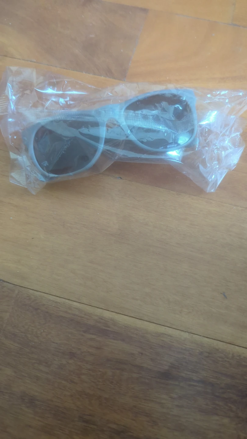 Gray plastic UV protection sunglasses in original packaging