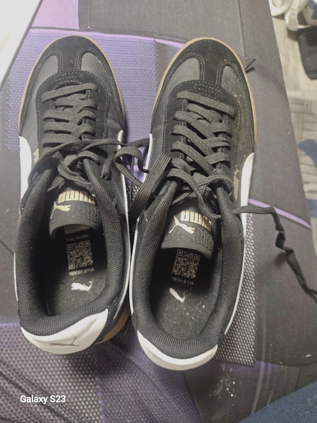 Puma black and white athletic shoes