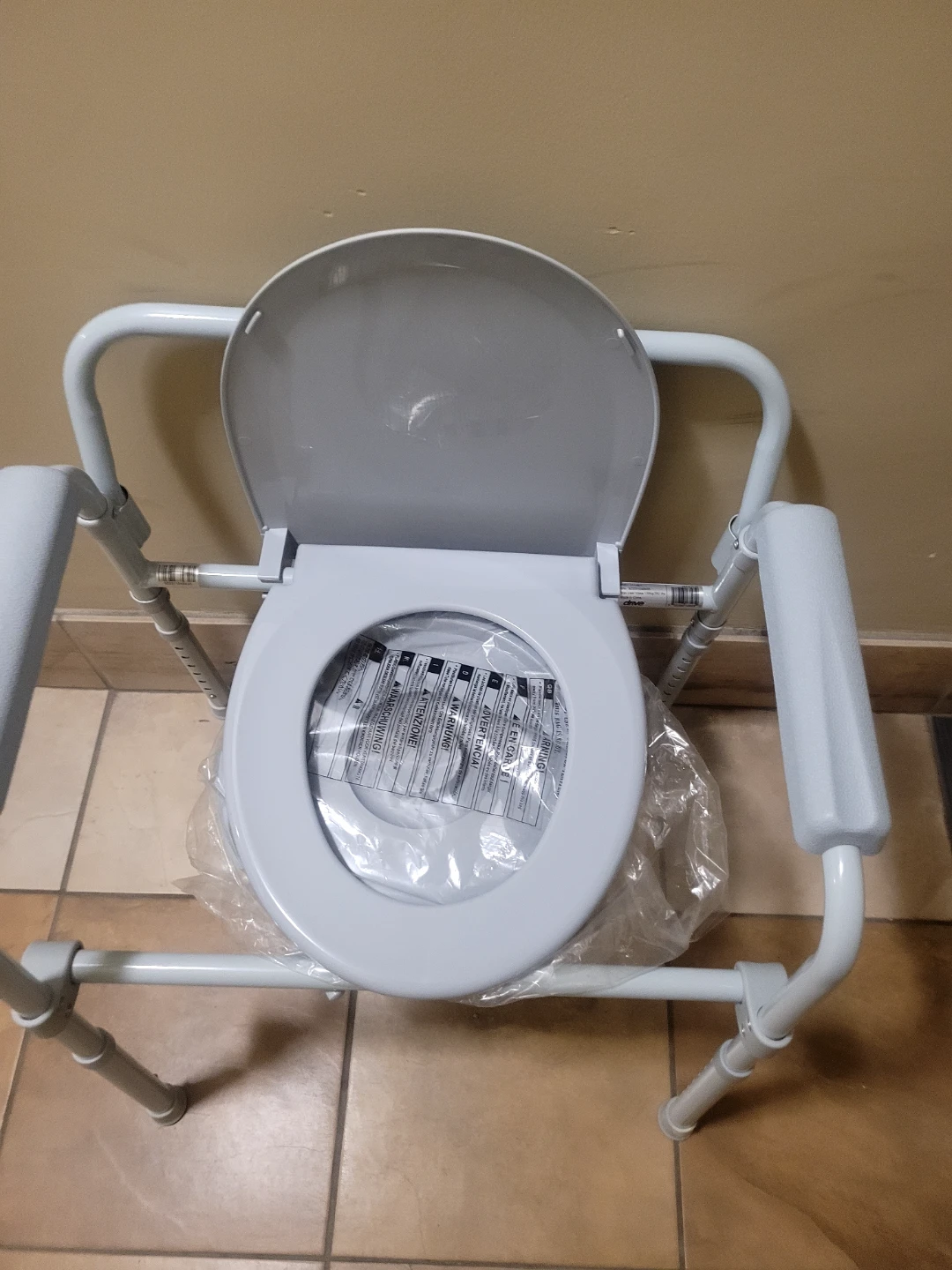 Adjustable Height Toilet with Padded Arms