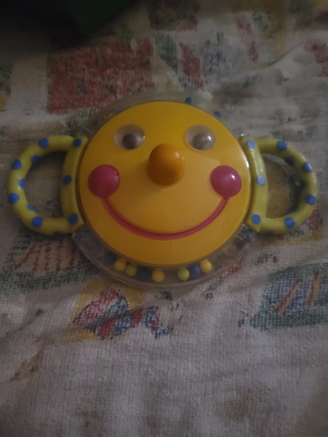 Sassy smiley face mirror rattle
