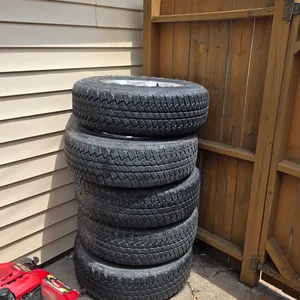Bridgestone Dueler A/T Tires with Jeep Rims (Set of 5)
