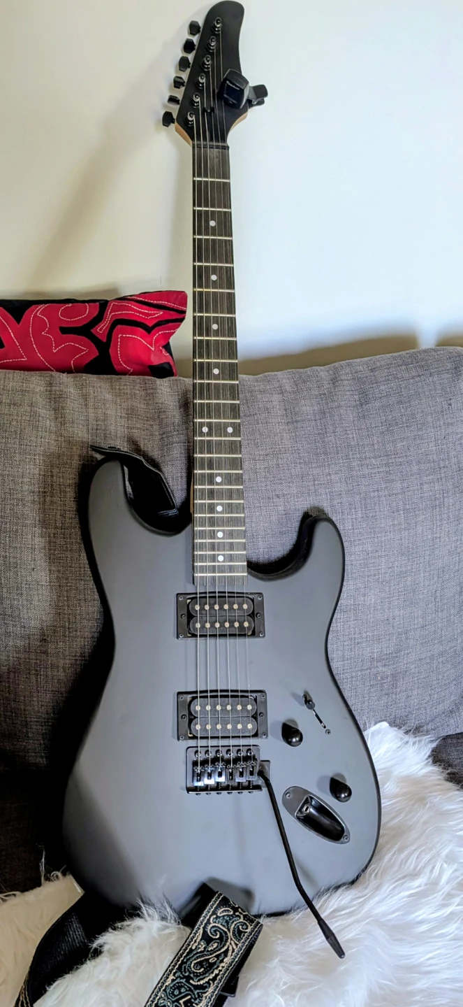 Black Electric Guitar with Amp