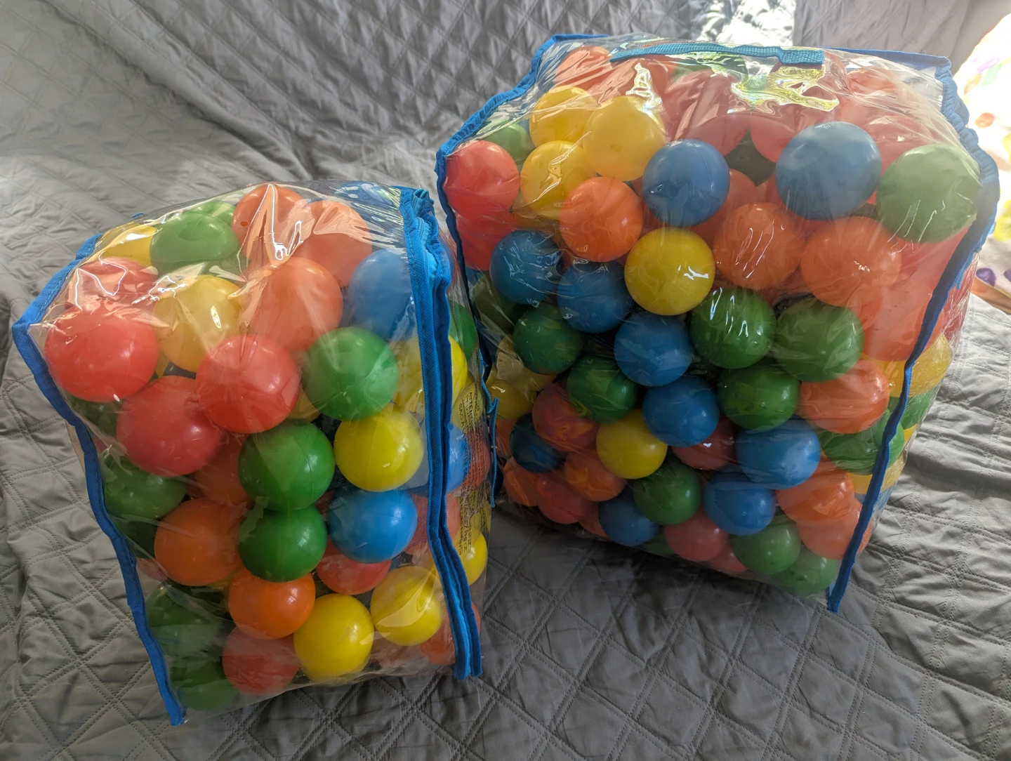 Bags of colourful plastic balls for ball pits.