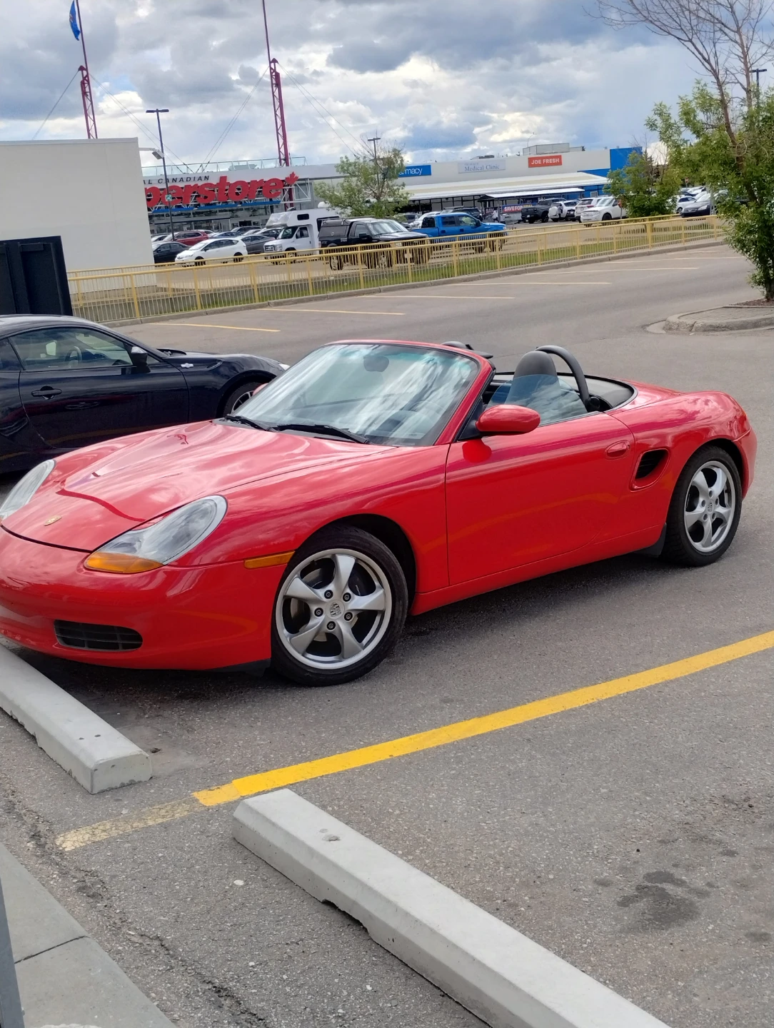 Red Porsche Boxster Convertible very low miles