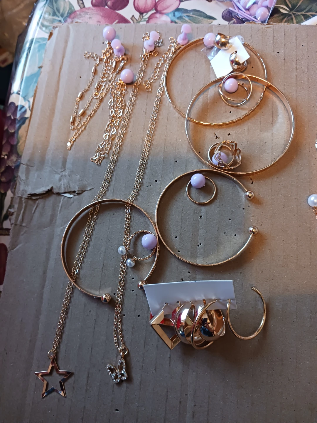 Gold-tone jewellery set with necklaces, earrings, and bracelets
