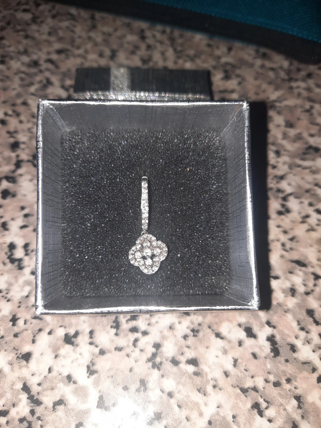 18k white gold with .55 in all natural diamonds