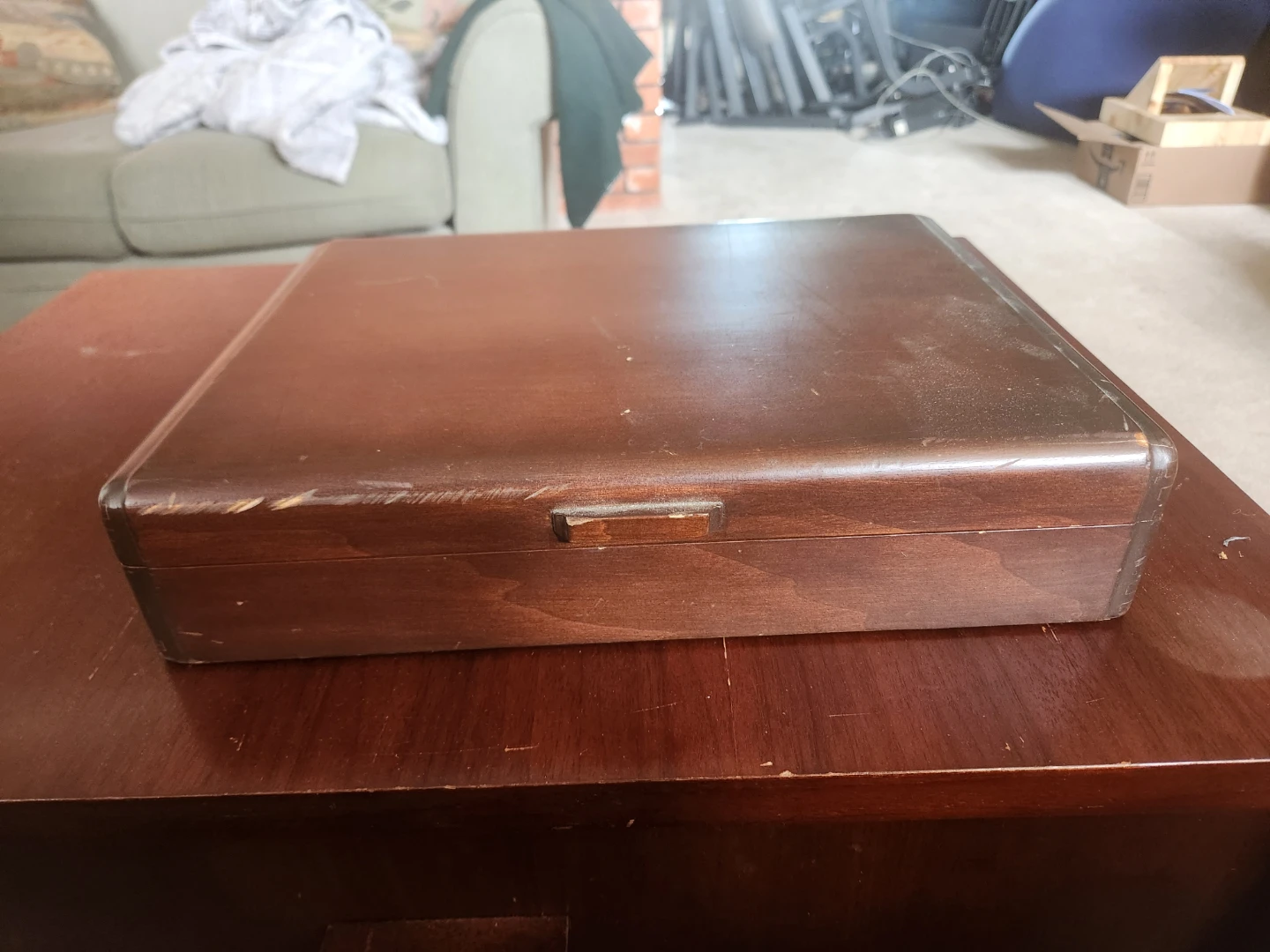 Wooden box with blue fabric lining on inside