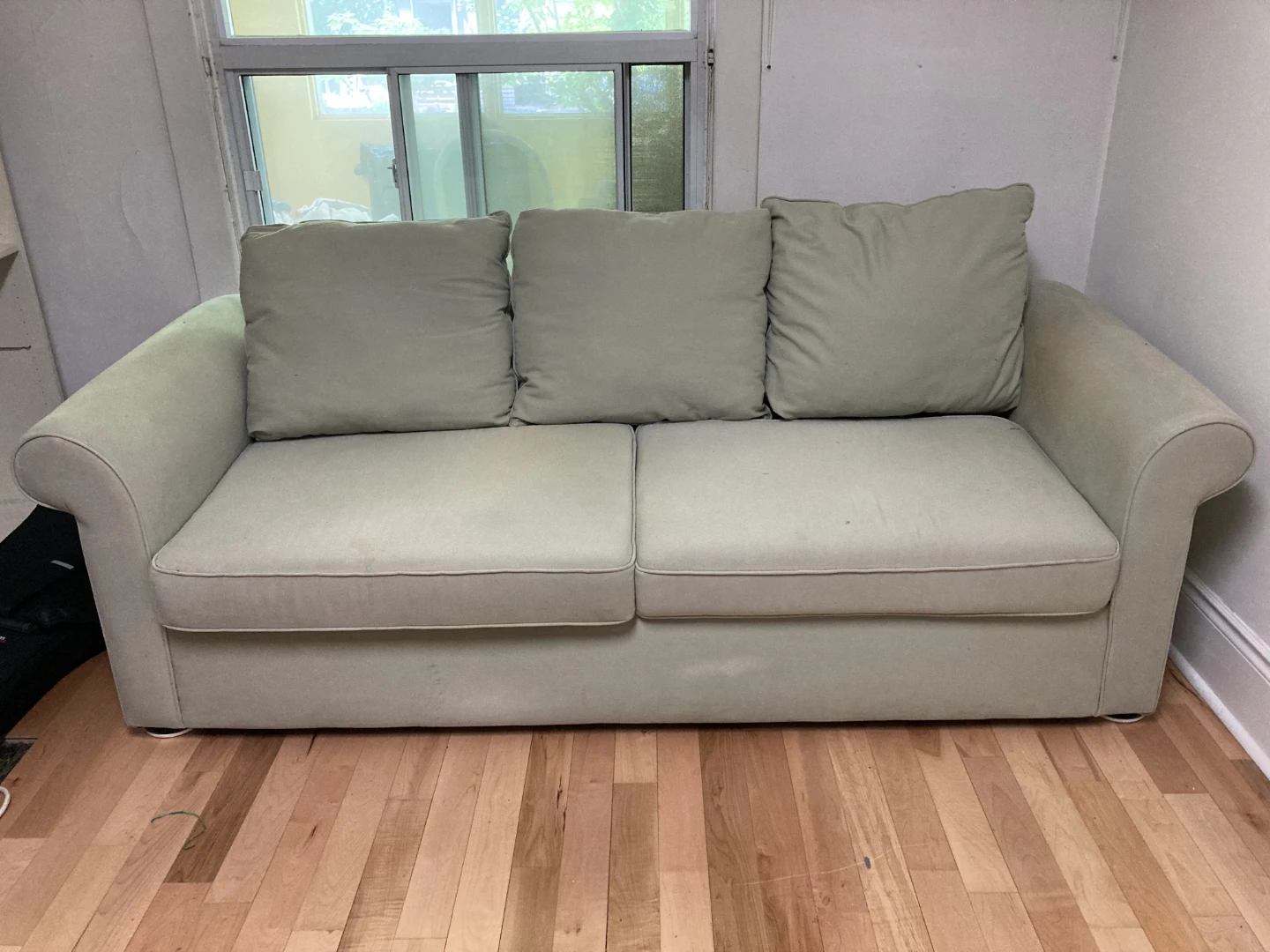 Light Green Sofa with Three Cushions