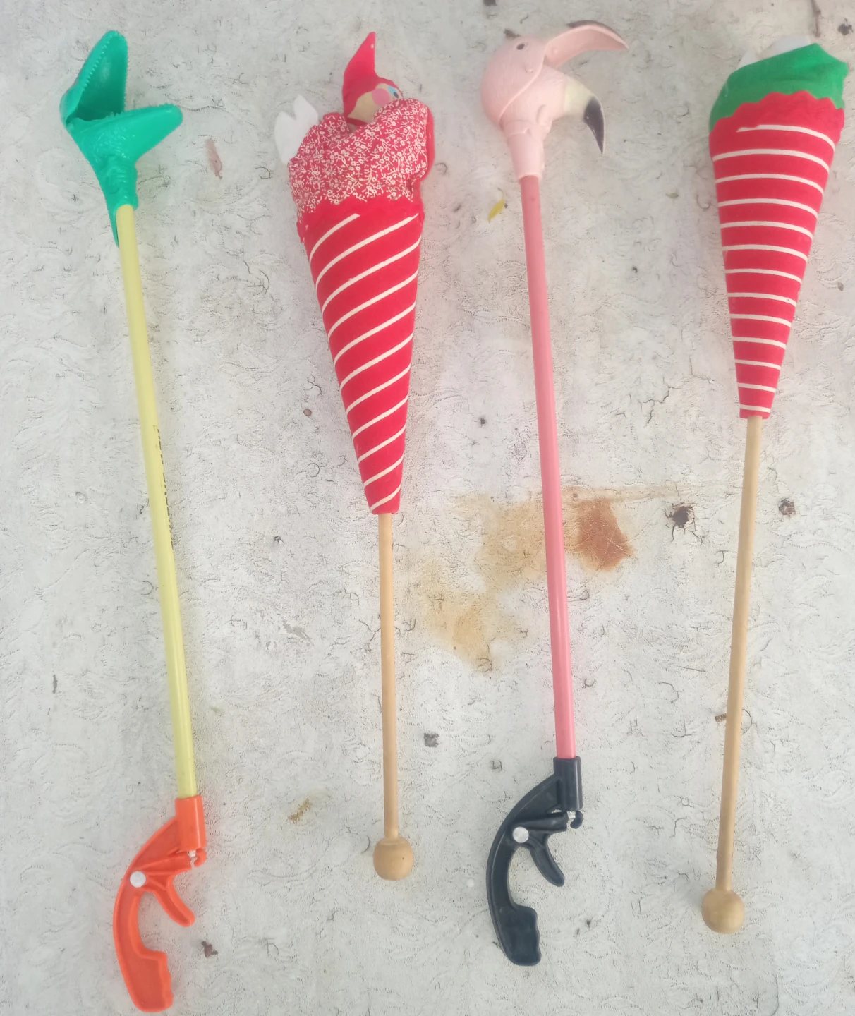 Four vintage novelty toy grabber sticks