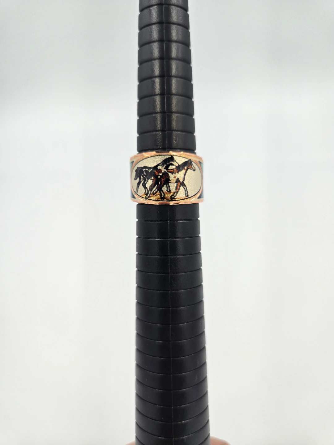 Native ring with horses and abstract design