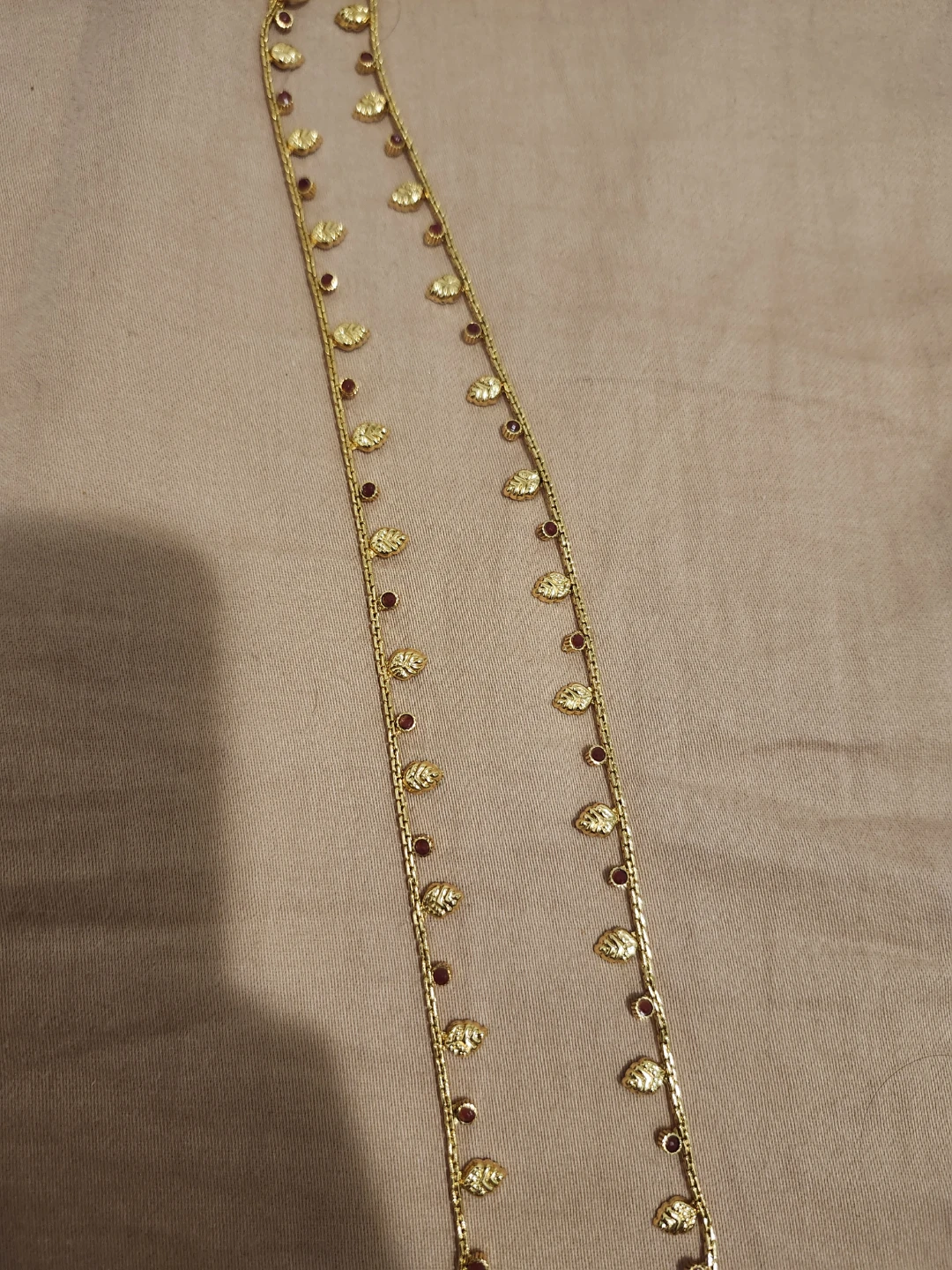 Gold-tone anklet with Leaf and Red Stone Accents