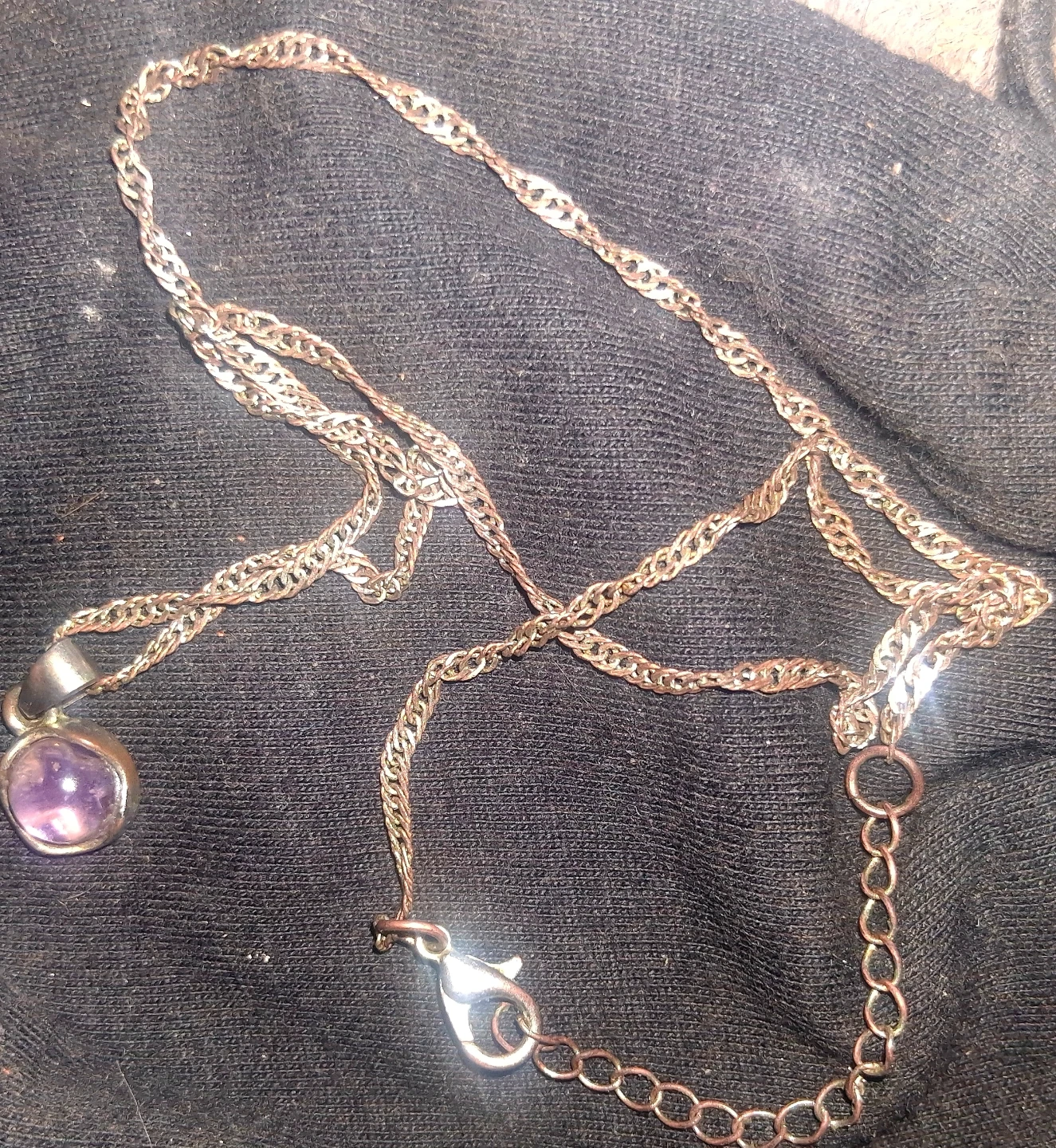 Silver tone necklace with amethyst pendant