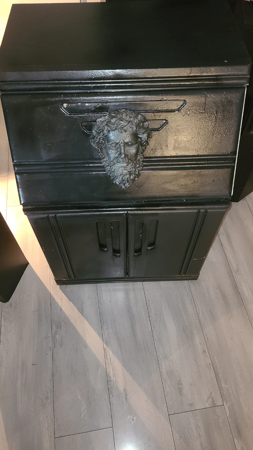 Black Cabinet with Ornate Face Detail