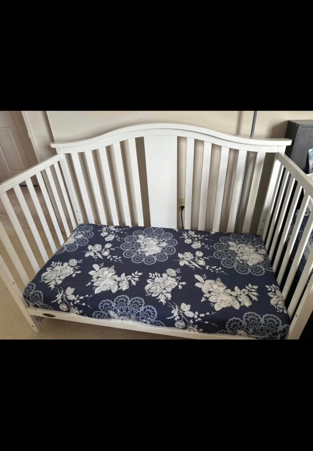 White Baby Crib with Floral Mattress
