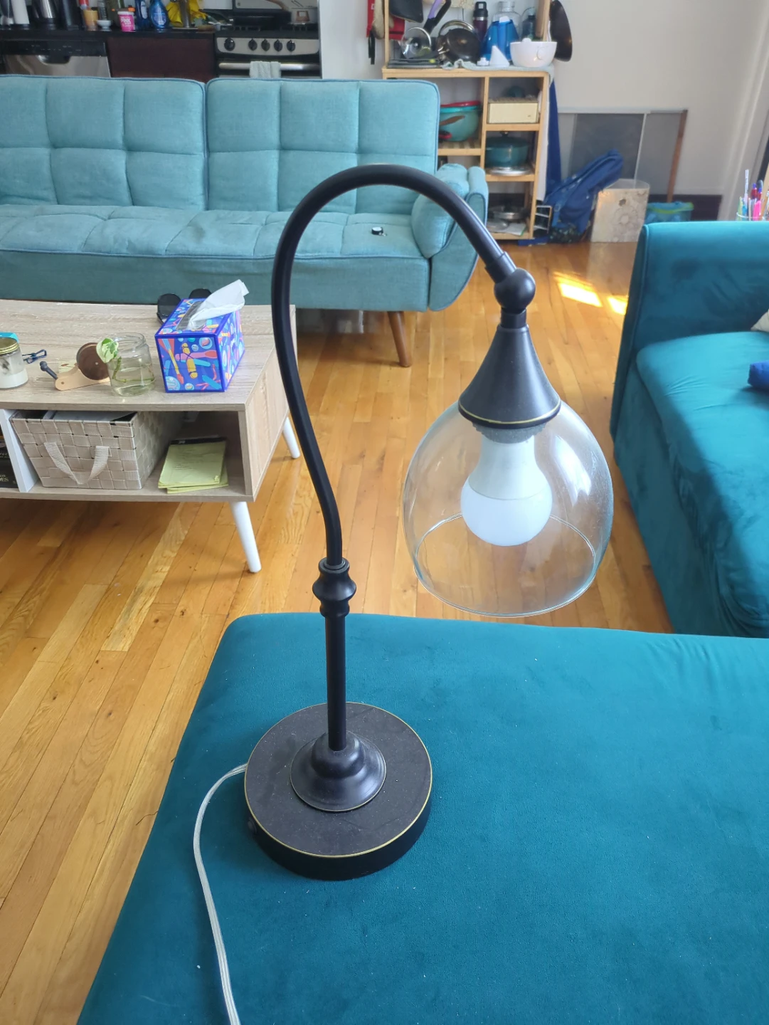 Black metal table lamp with glass shade and USB port