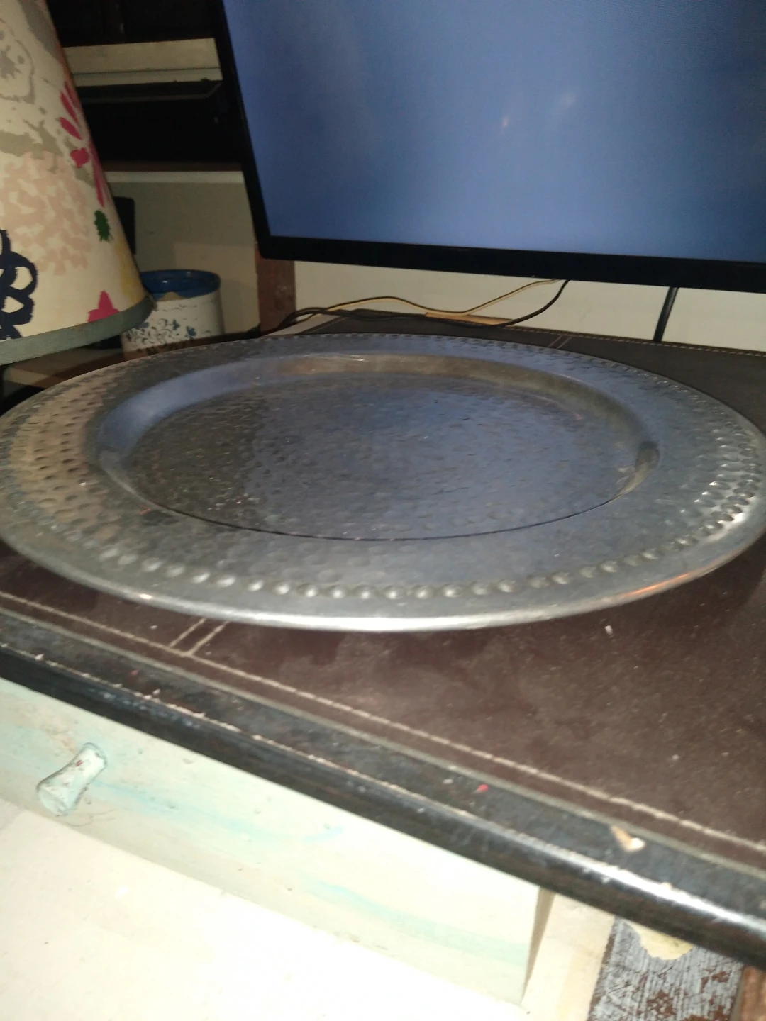 This is a 14-in round silver serving tray