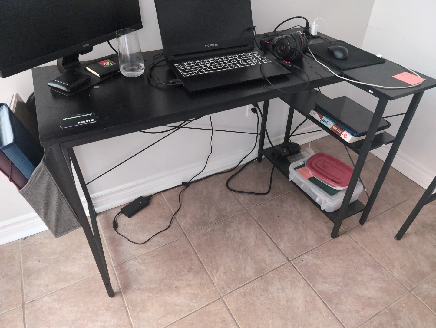 Black L-Shaped Desk with Shelves and power outlet