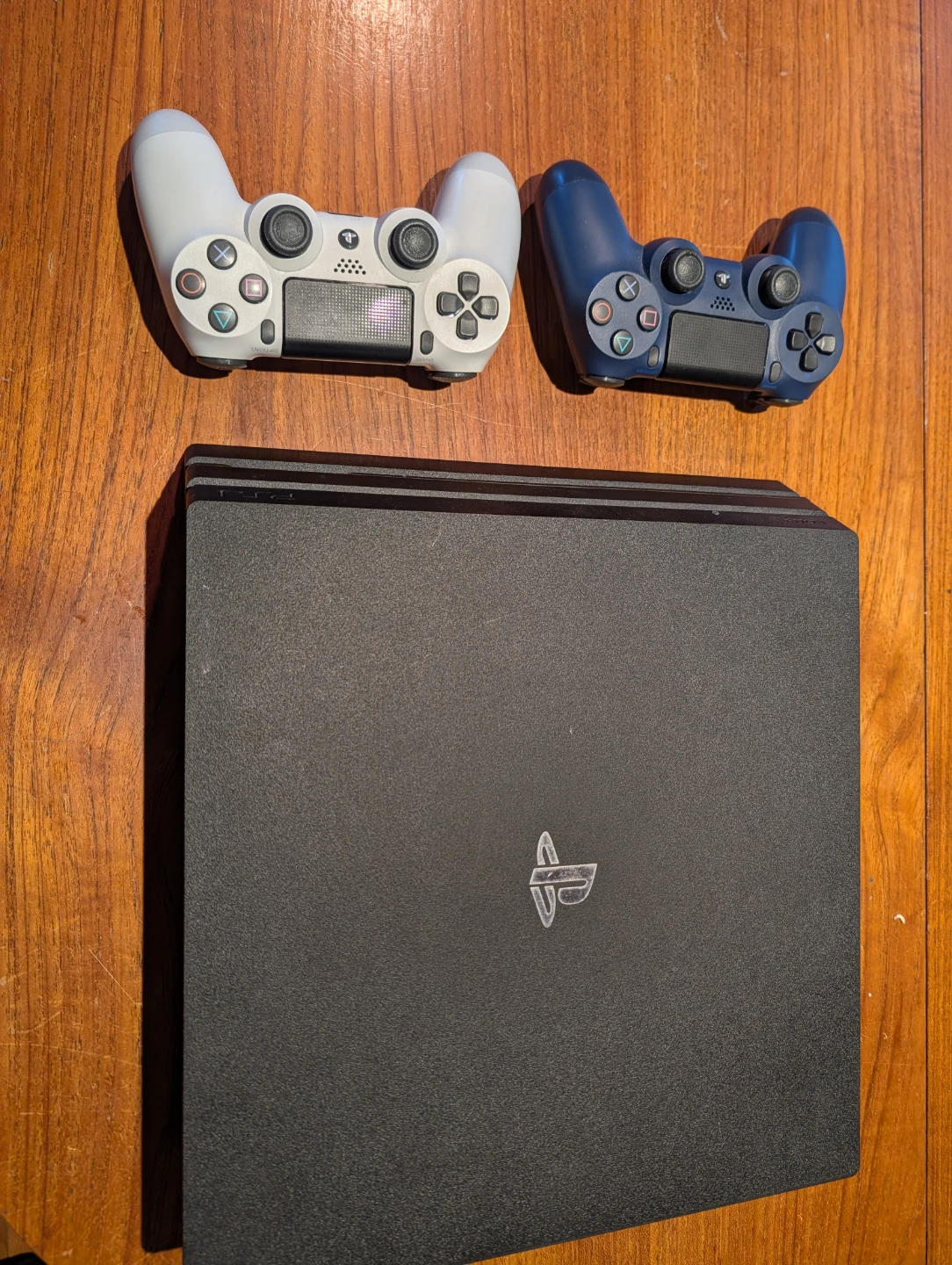 PlayStation 4 Pro Console with Two Controllers
