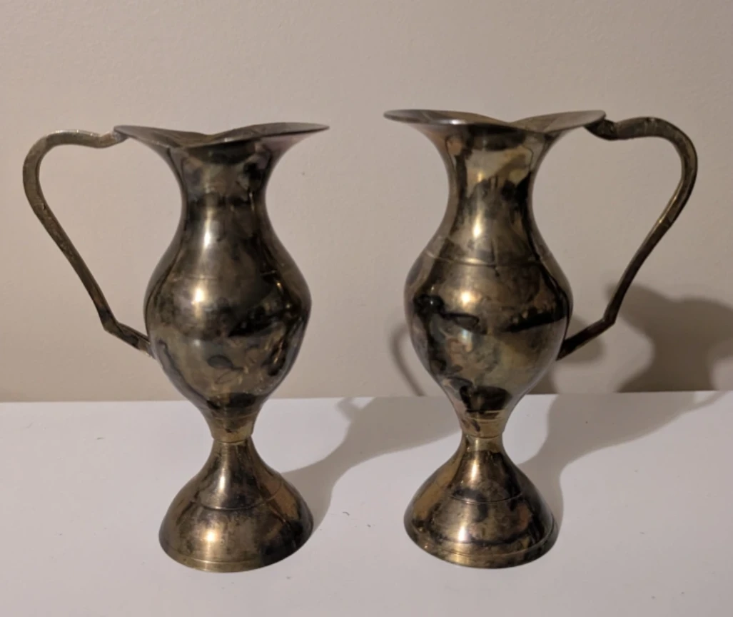 Pair of small decorative brass pitchers