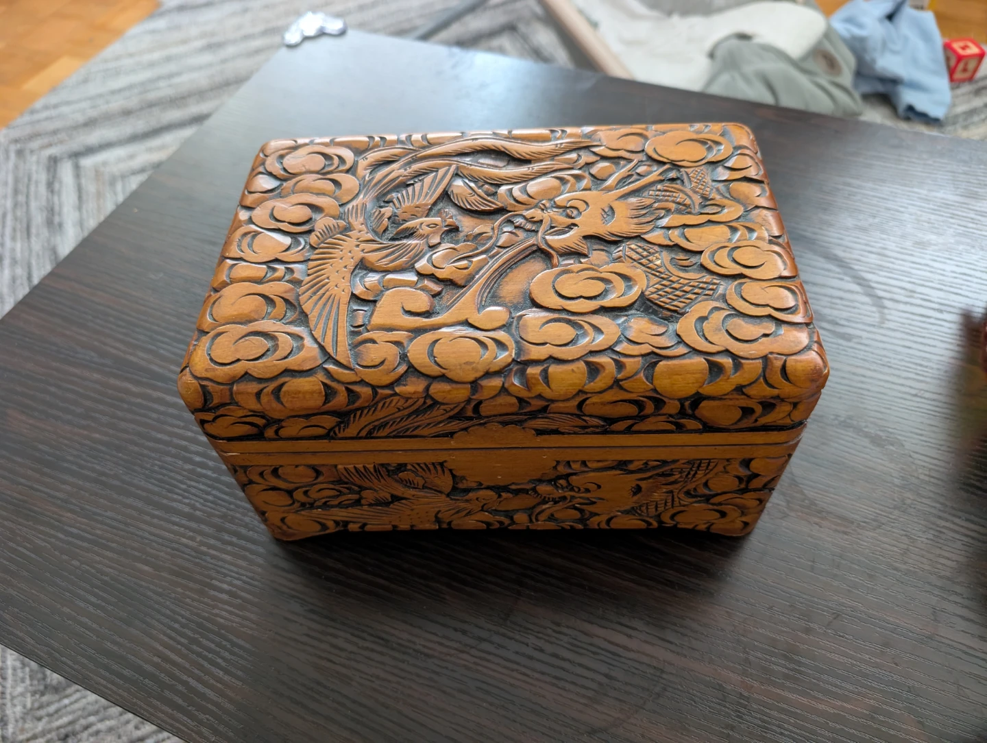 Carved wooden jewelry box with dragon and phoenix design