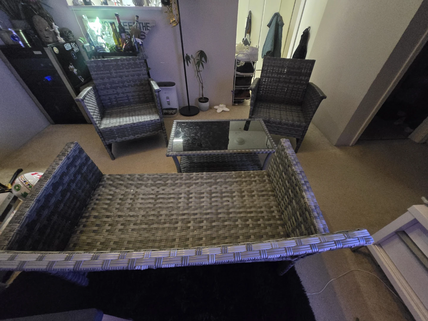 Wicker patio set with glass top coffee table