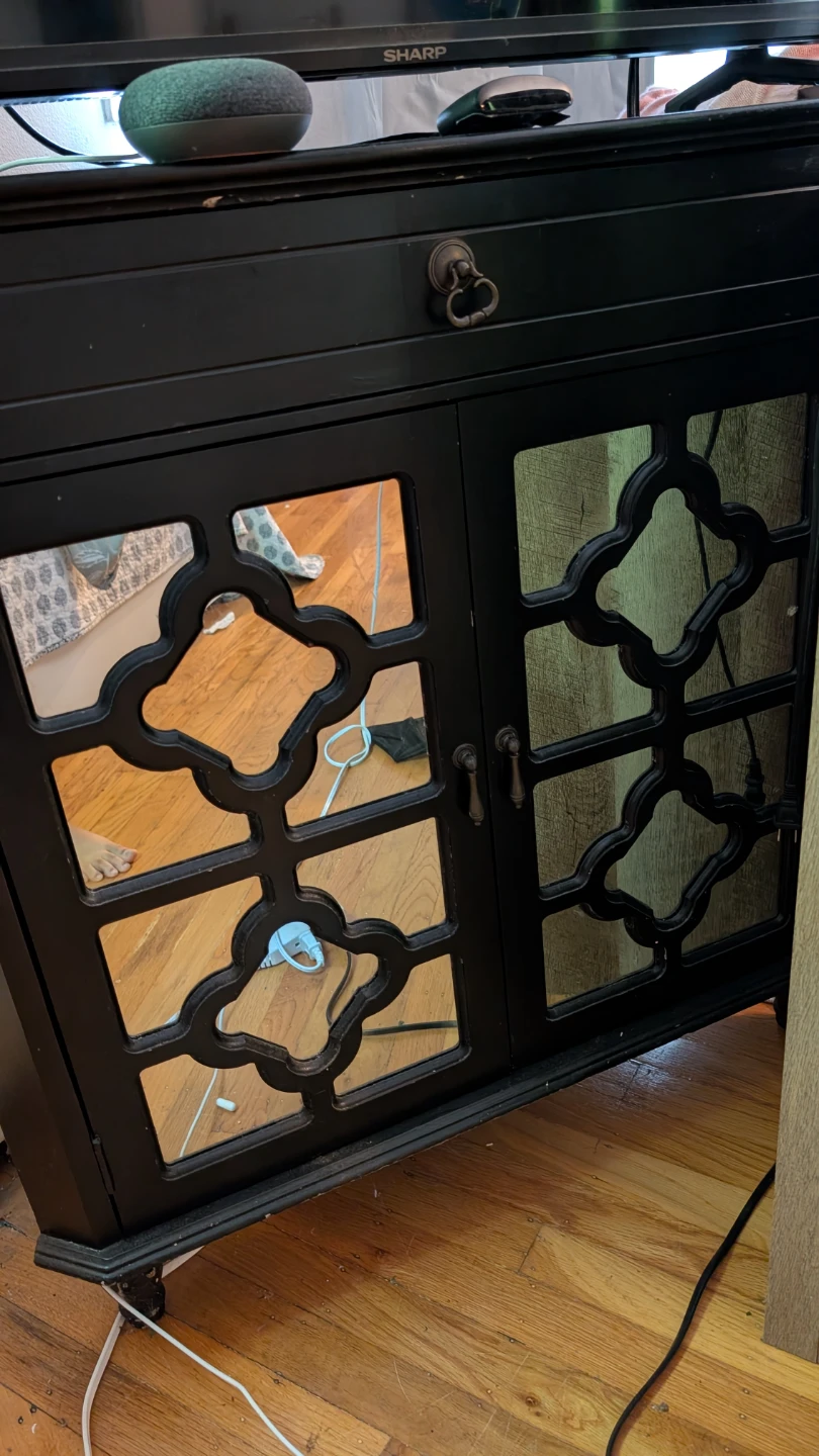 Black Two-Door Cabinet with Decorative Glass Panels