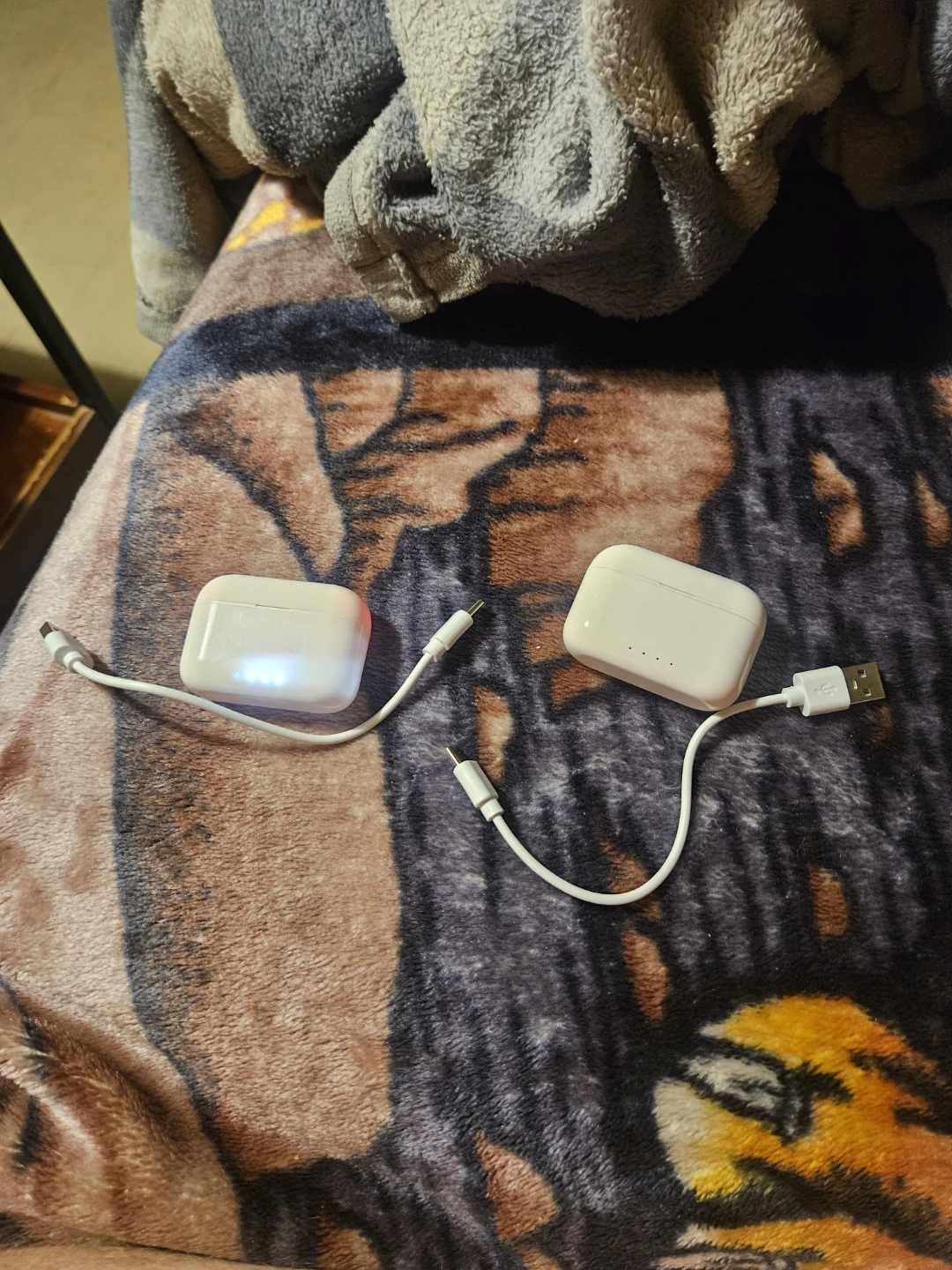 White Wireless Earbud Charging Cases (2) with ear buds