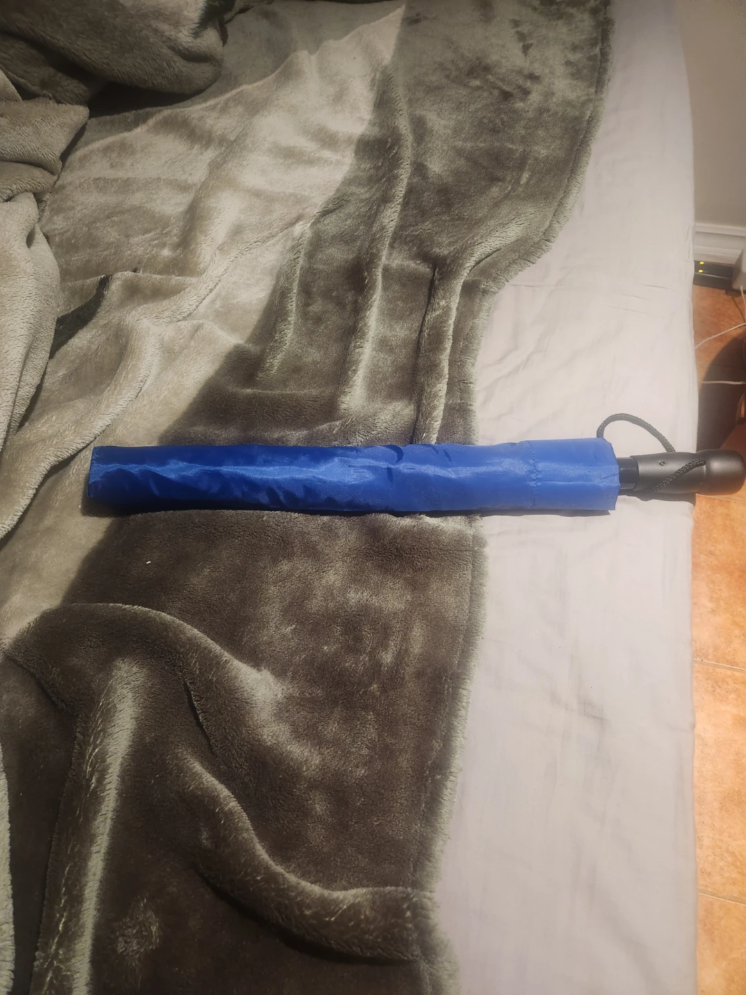 Blue folding umbrella
