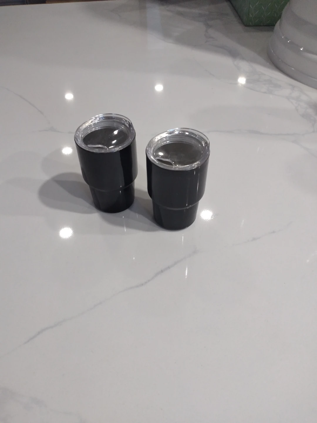 2 thermoses shot-sized.