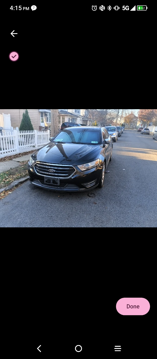 Black Ford Taurus Limited Sedan