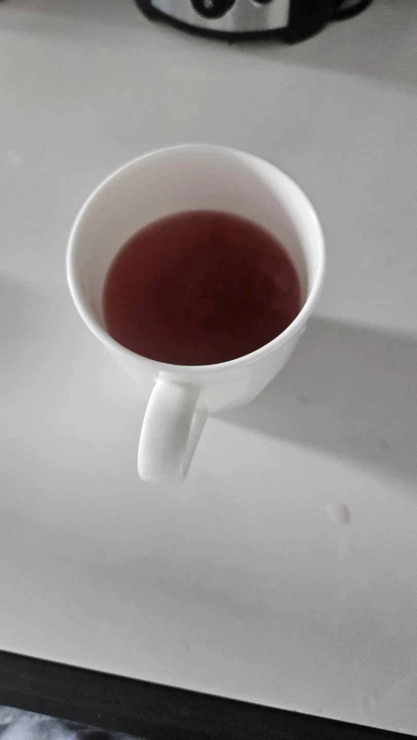 White Ceramic Mug with Reddish Beverage ⚽️