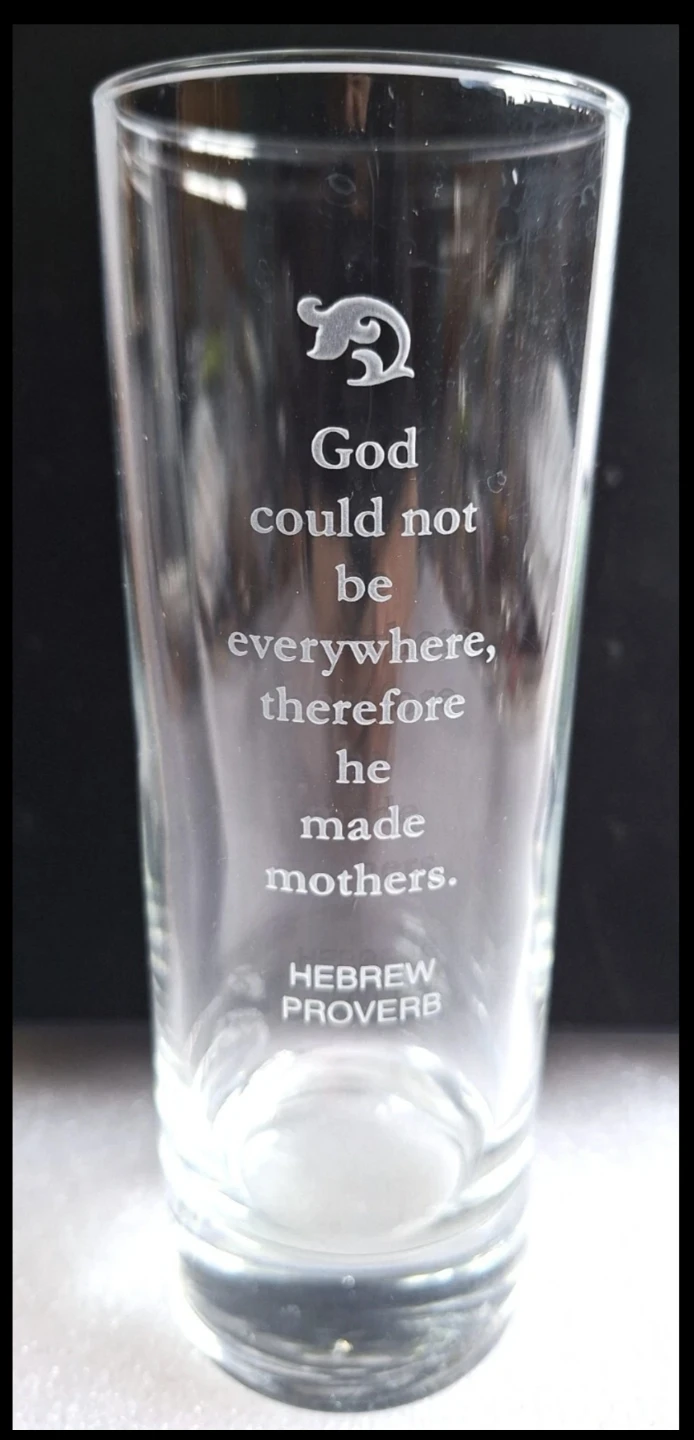 Glass with "God could not be everywhere" quote ⚽