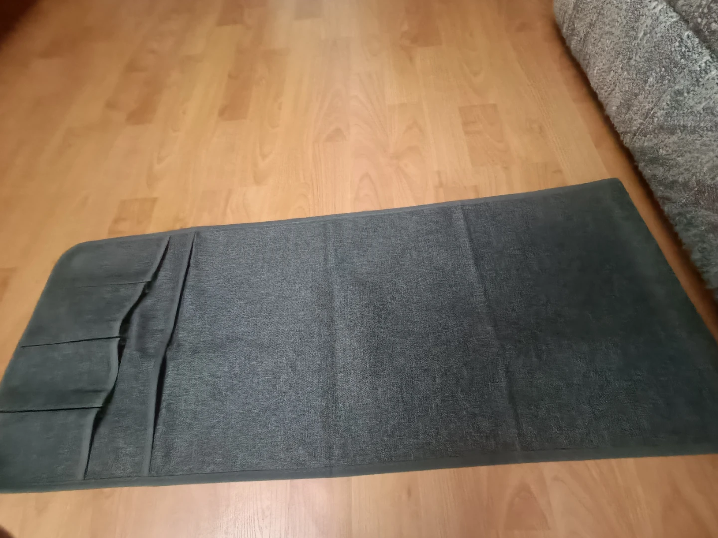 Grey fabric organizer with pockets