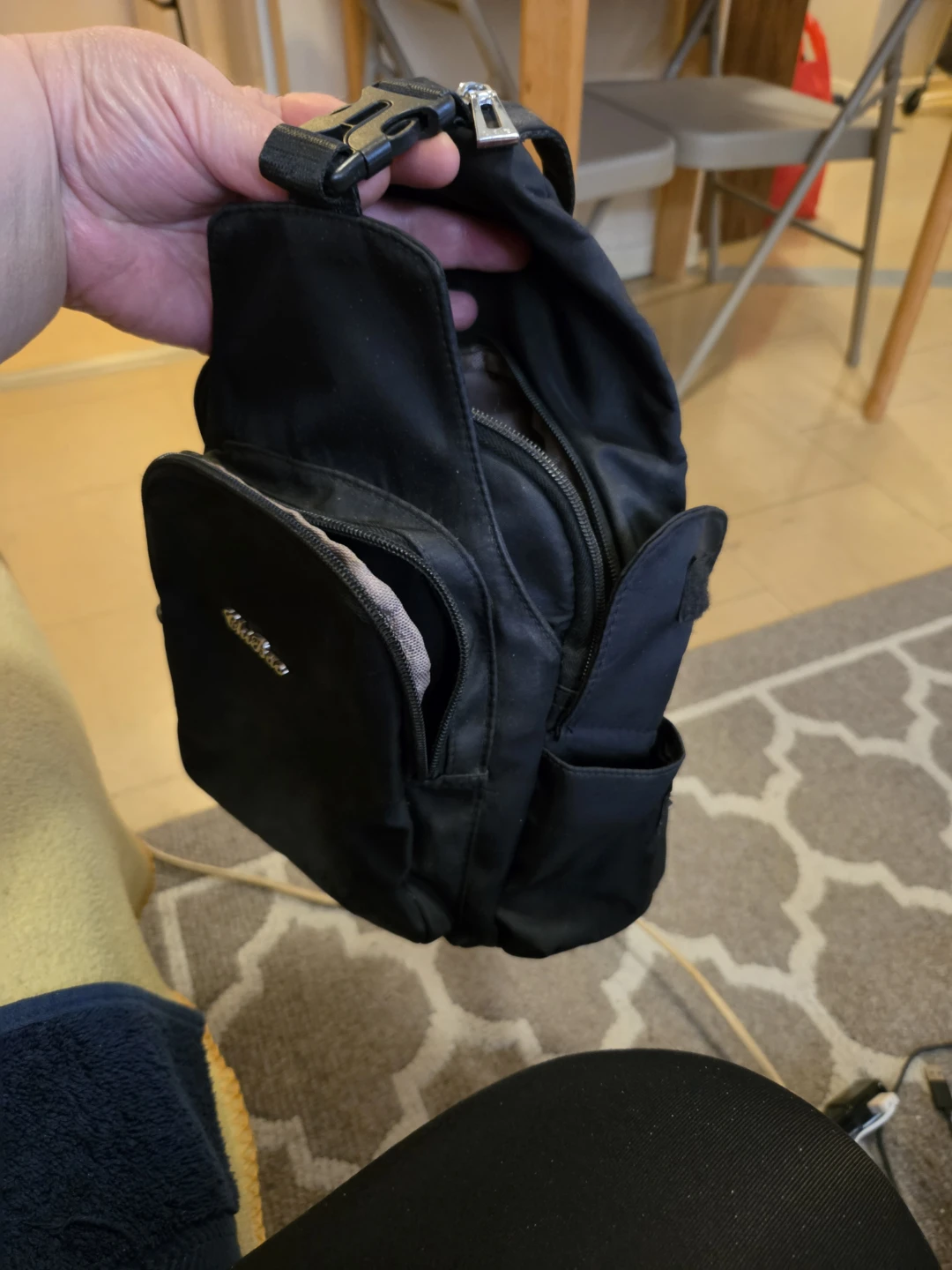 Black sling backpack
