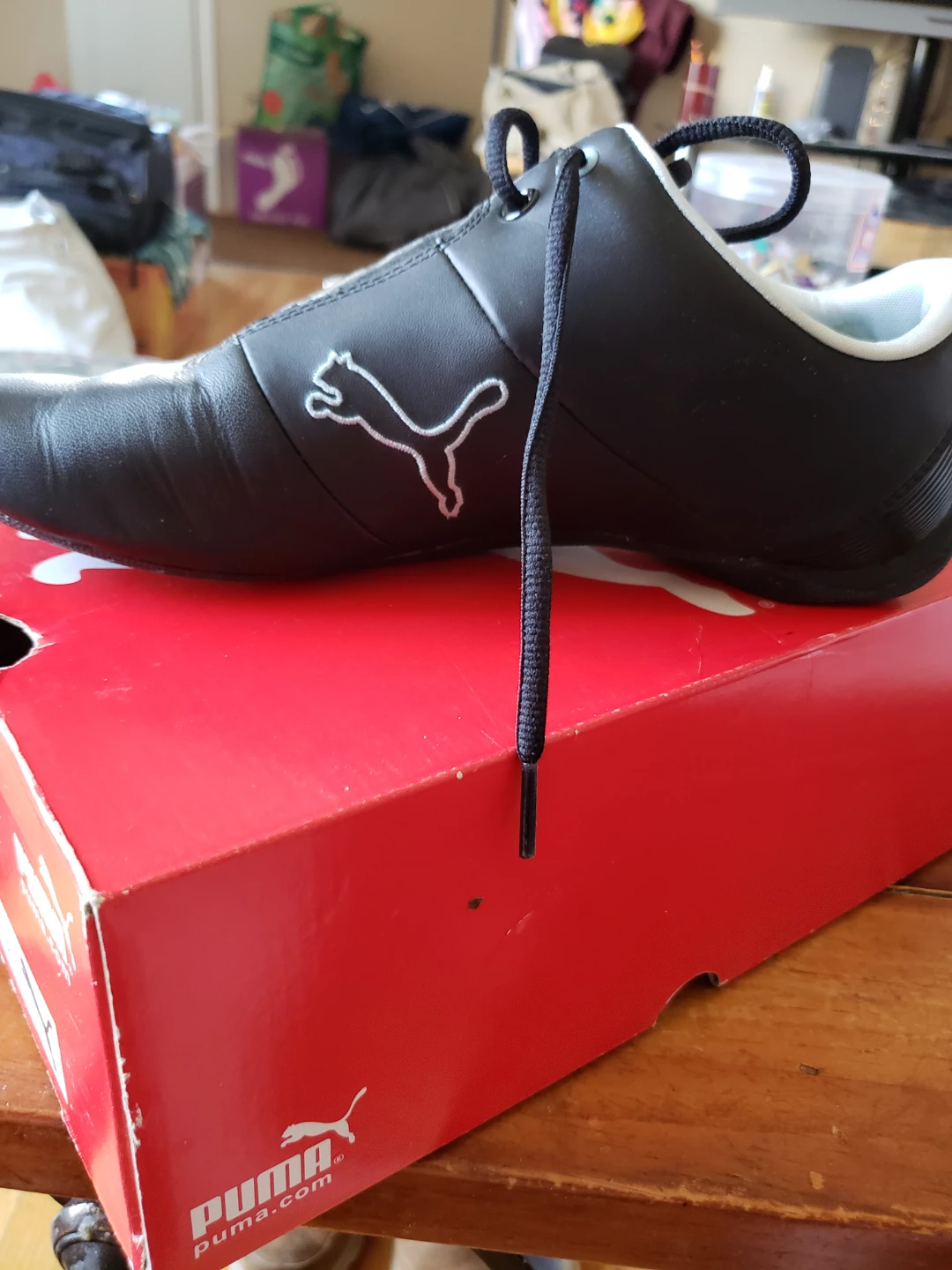 Puma black shoes with light blue accents