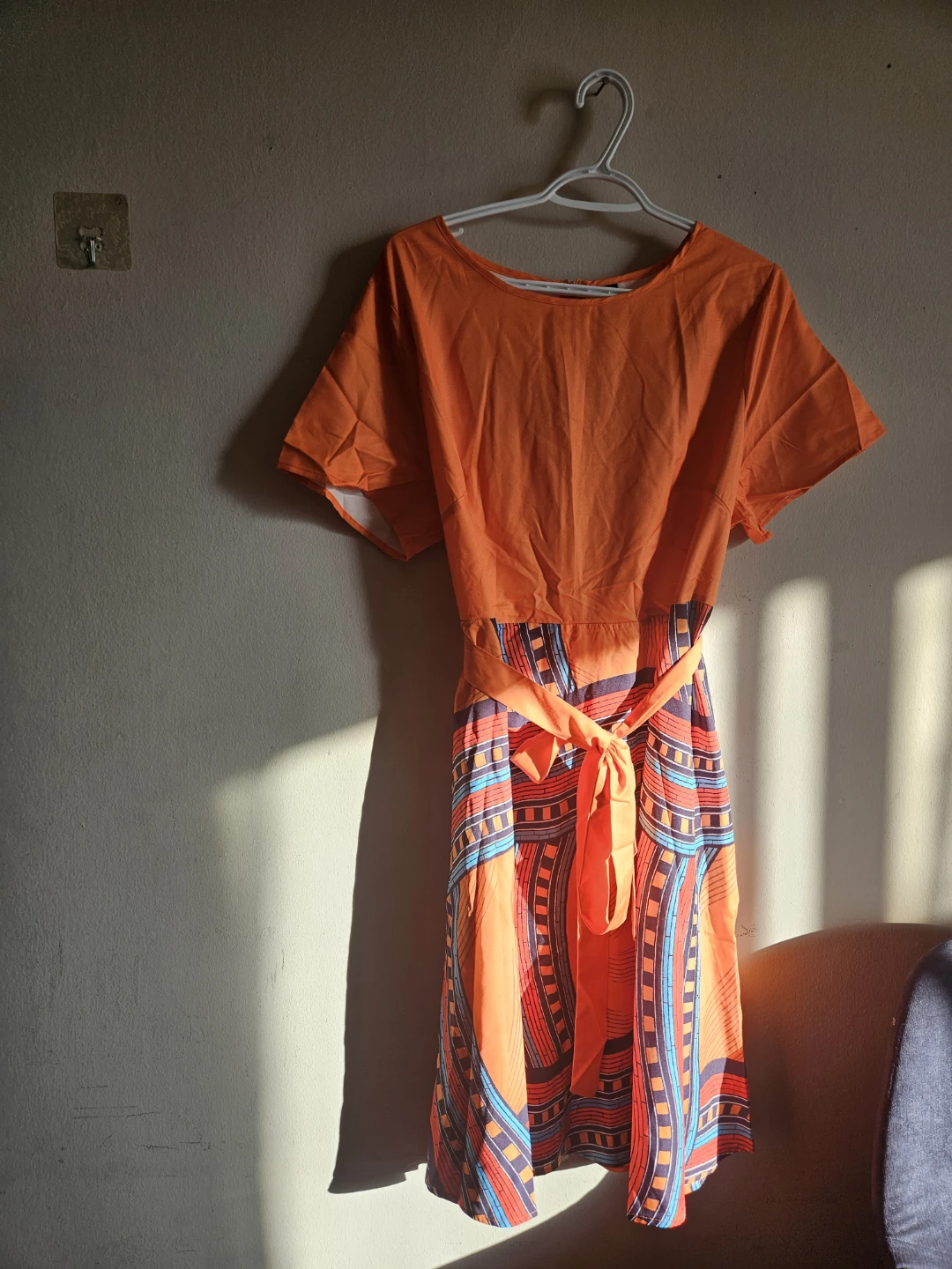 Orange patterned midi dress