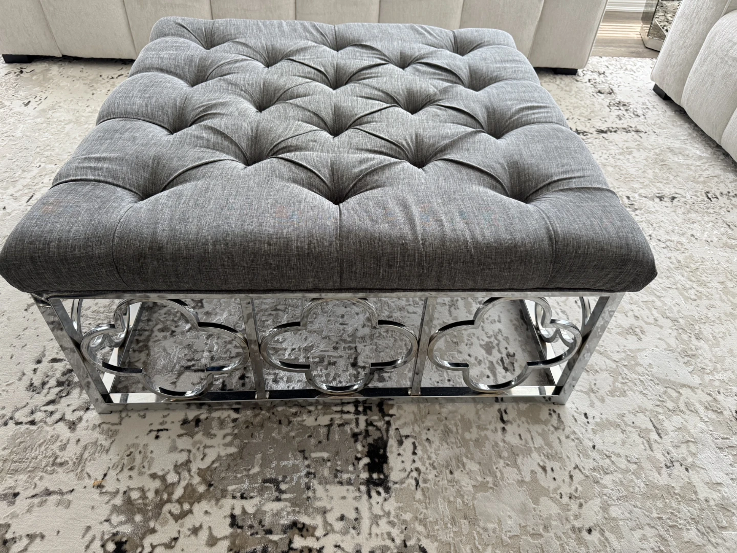 Tufted Ottoman with Mirrored Base