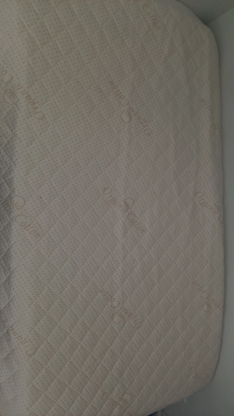 Twin bed with foam topper and organic cotton mattress cover