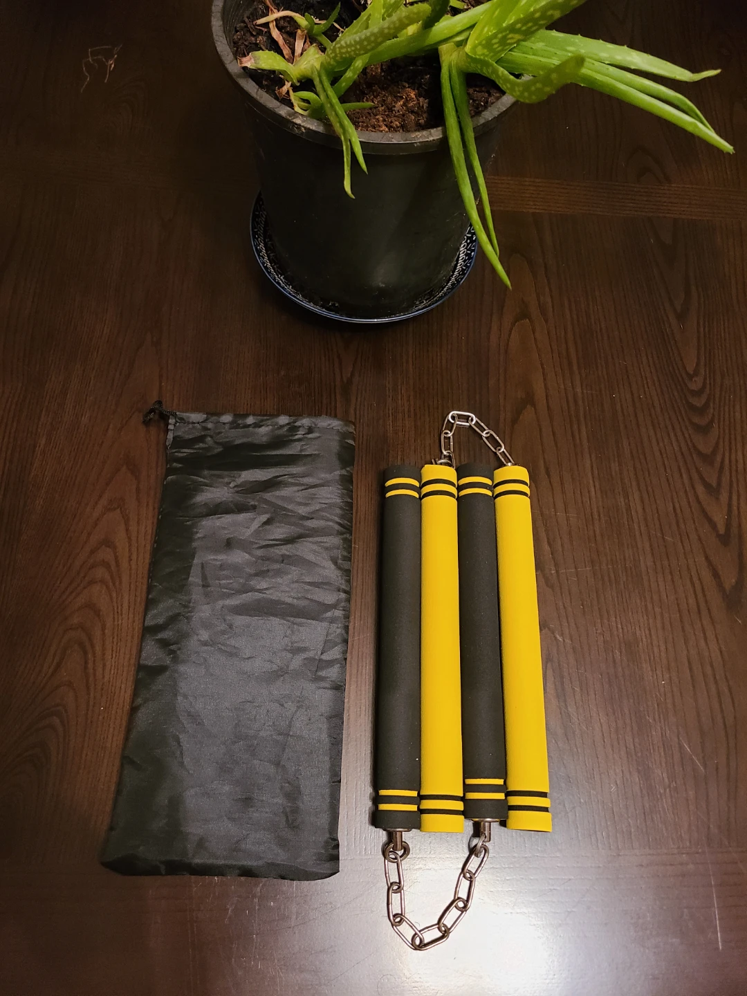 Brand New Black and Yellow Nunchucks with Pouch