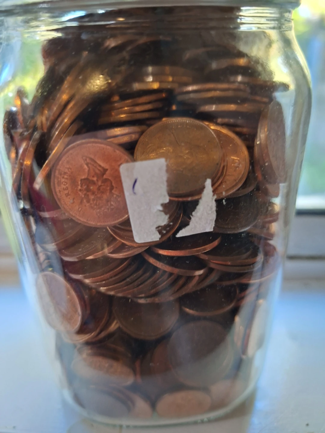 Glass pickle jar full of pennies - photo 3