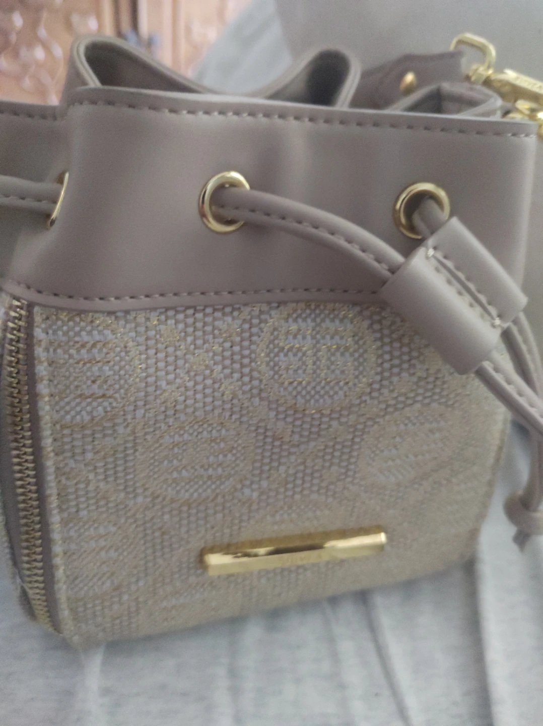 Beige bucket bag with gold accents - photo 2