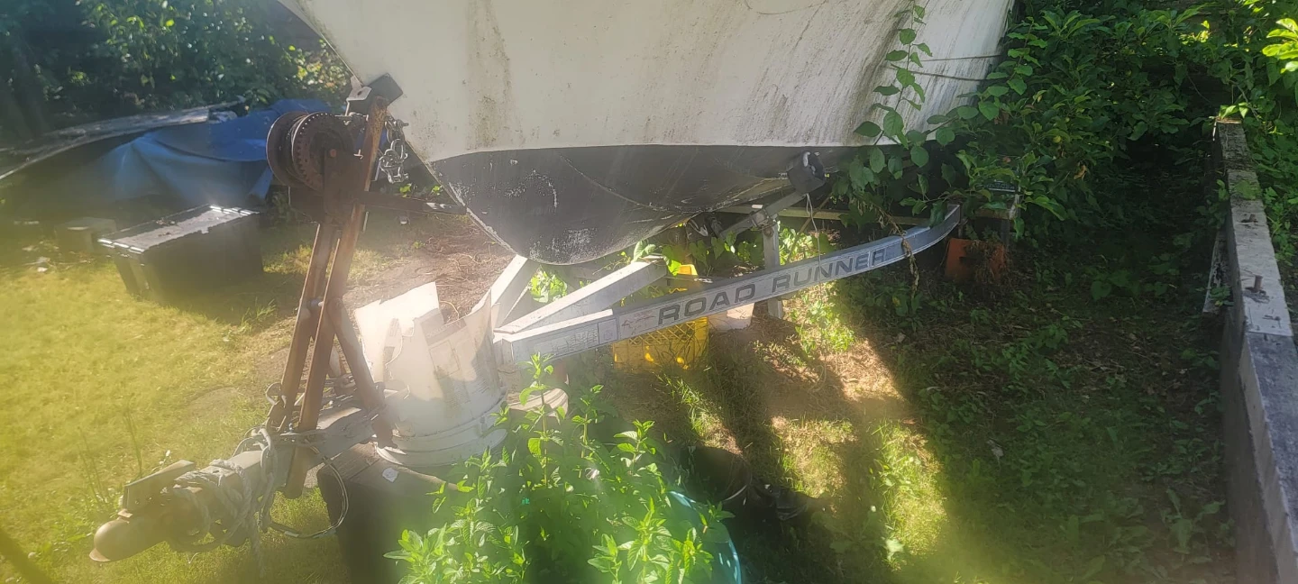 Used Boat on Road Runner Trailer