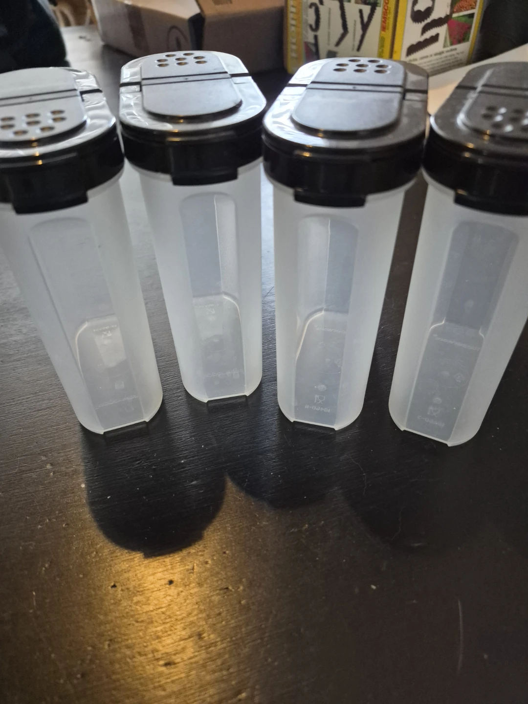 Set of 4 clear plastic spice shakers
