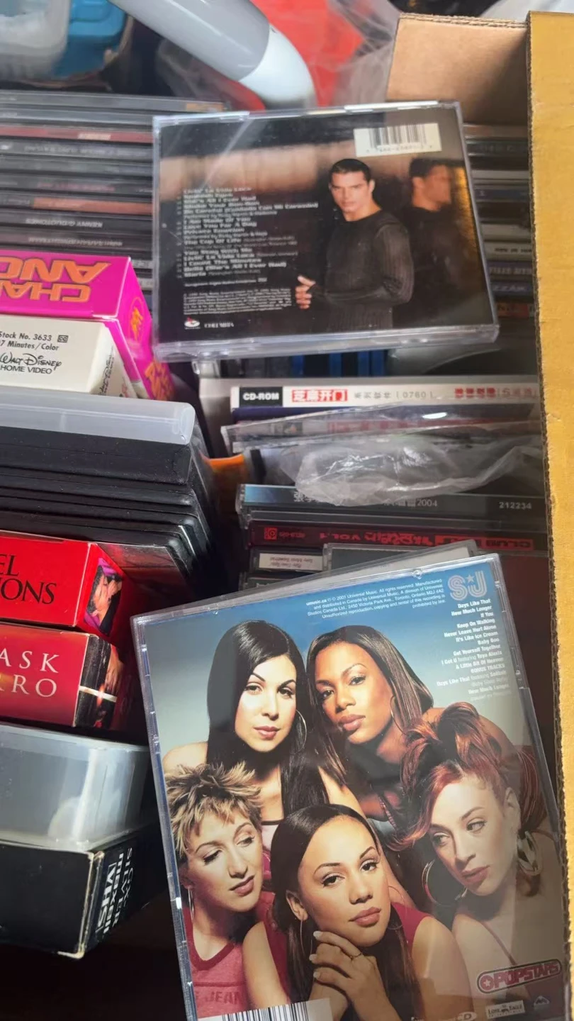 Various CDs and VHS tapes